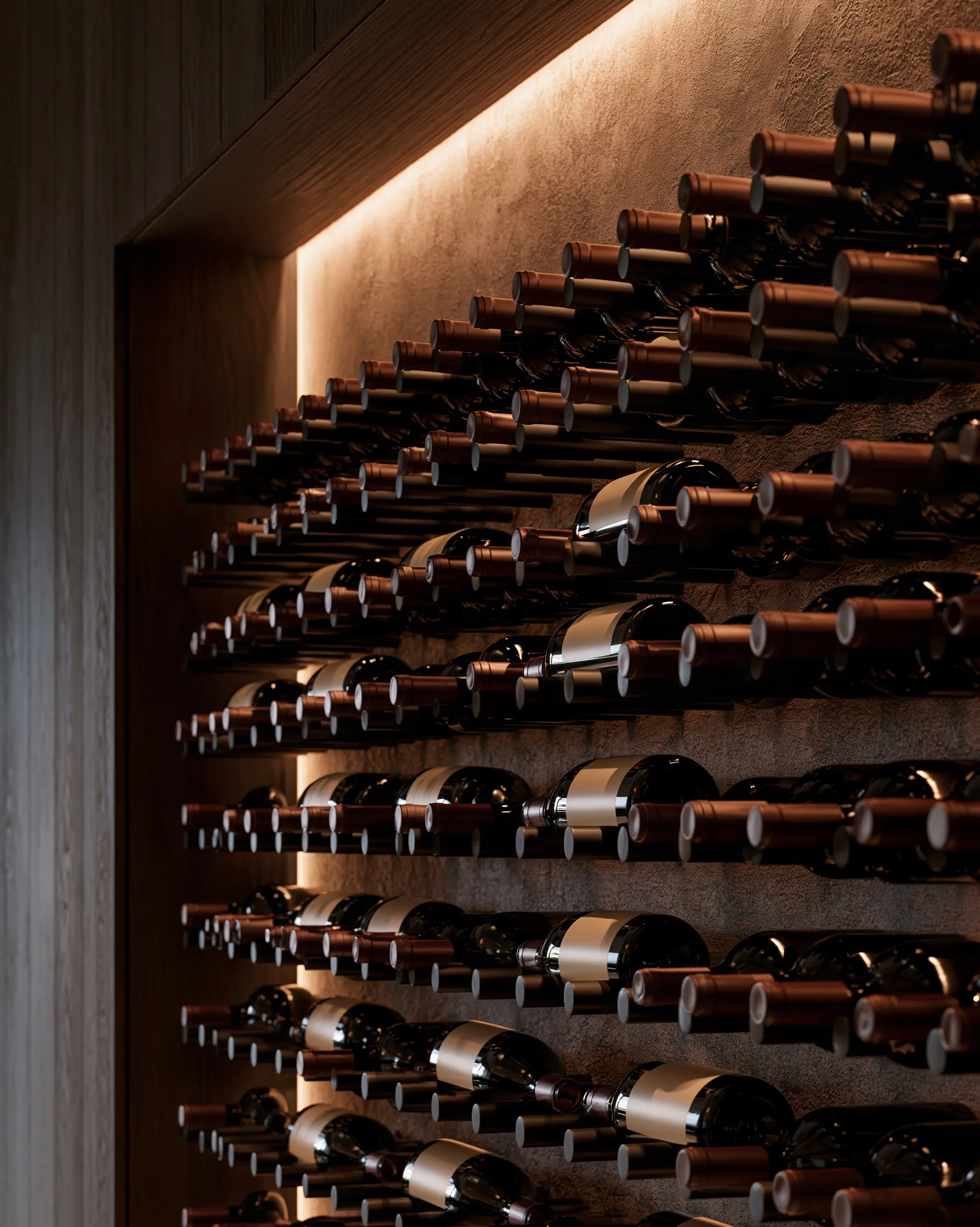 Bottles resting on rows of wall-mounted metal pegs against textured plaster, washed by a concealed LED strip
